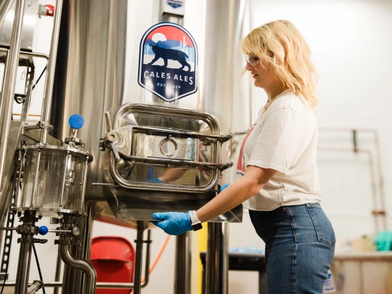 Fermentation science student Gracie Walters works in the CALES Ales brewhouse at Cork & Craft.